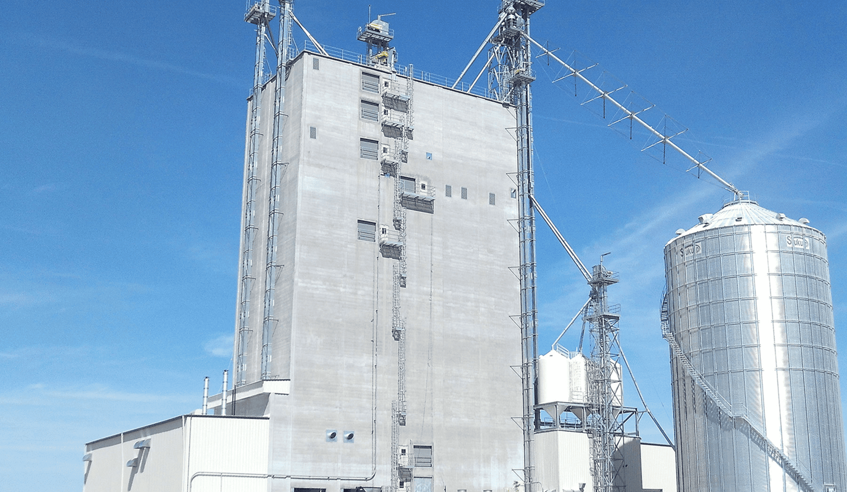 Agricultural storage building and metal silo.