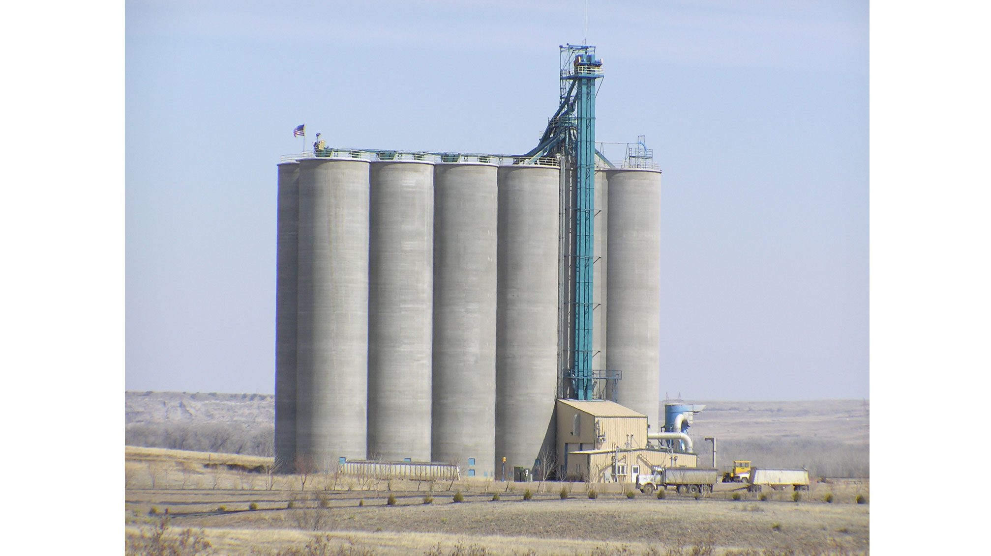 Industrial silos under clear sky