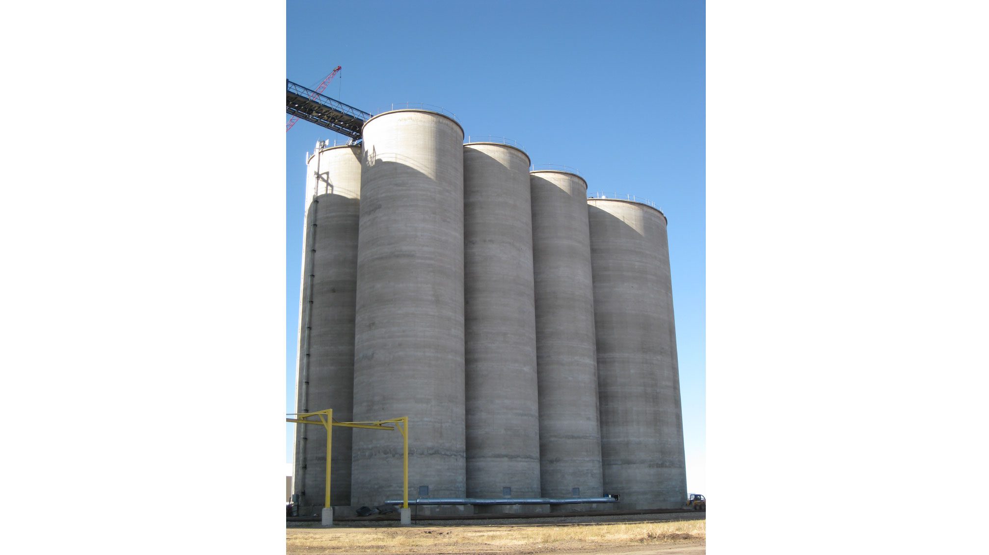 Tall silos under bright blue sky